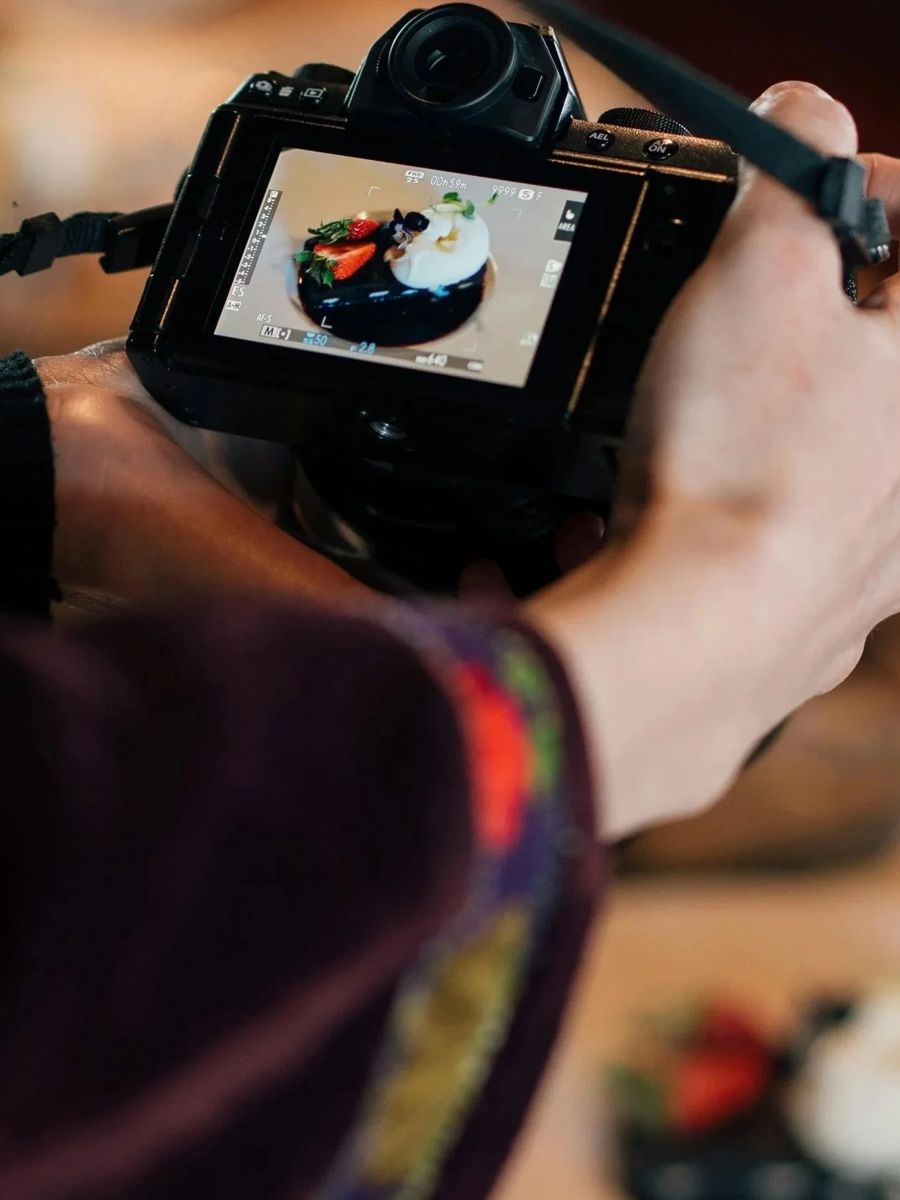 Photographer shooting a dessert on location